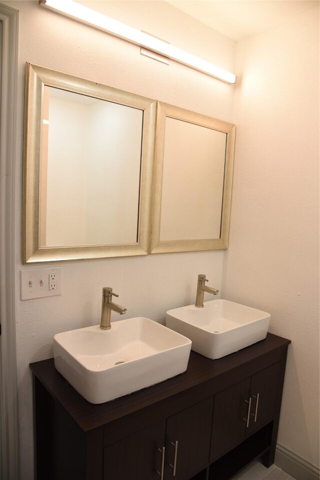 4841 Bromfield St, Dallas, TX 75216 - bathroom featuring double vanity and a sink