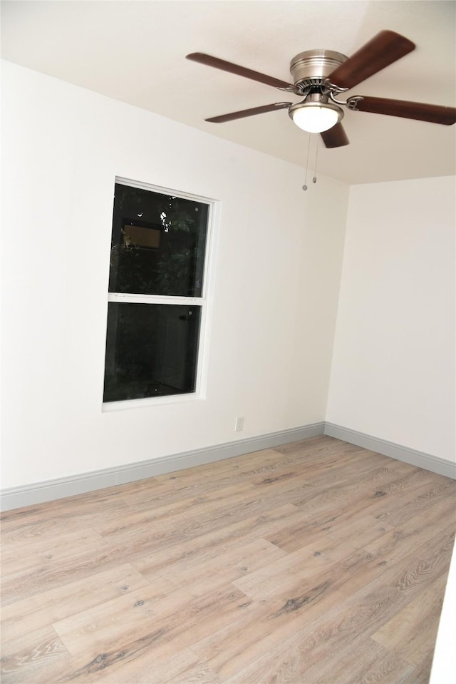 4841 Bromfield St, Dallas, TX 75216 - empty room with ceiling fan, baseboards, and light wood-type flooring