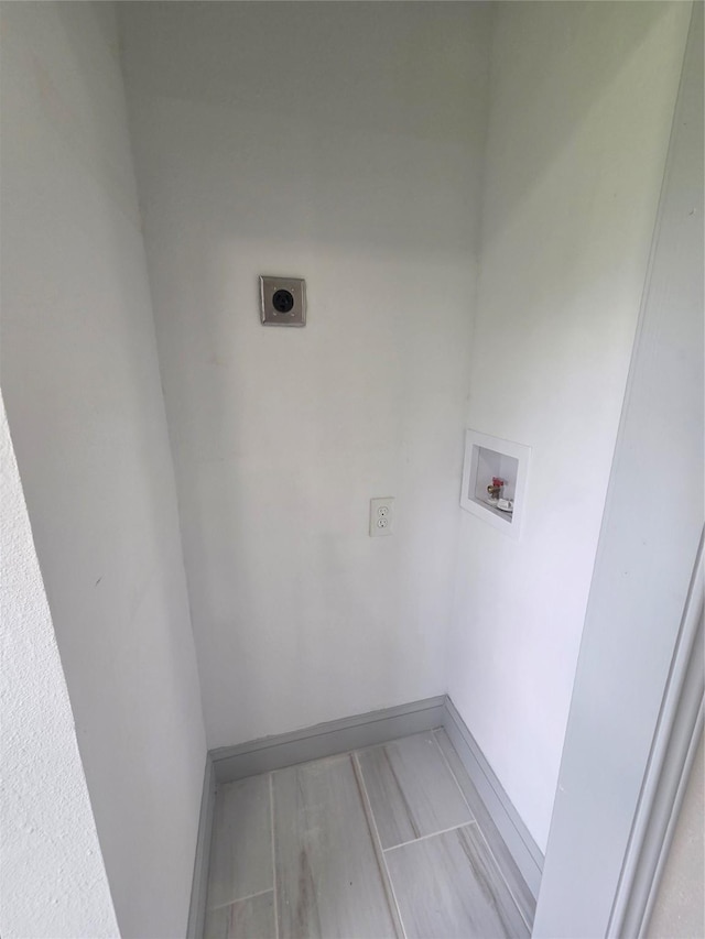 4841 Bromfield St, Dallas, TX 75216 - washroom with baseboards, laundry area, hookup for an electric dryer, and hookup for a washing machine