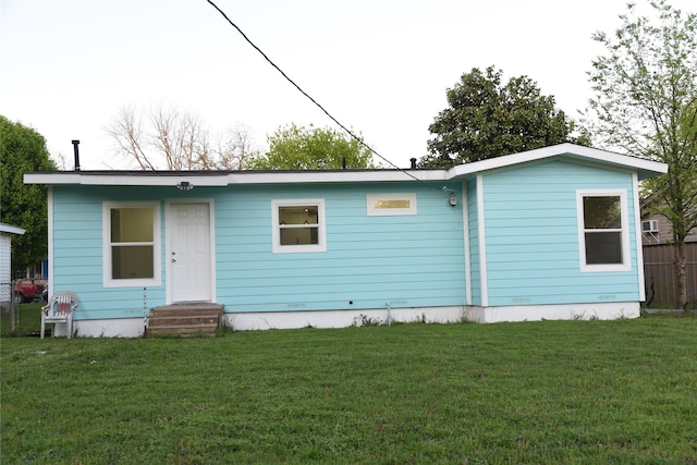 4841 Bromfield St, Dallas, TX 75216 - rear view of house with a yard and entry steps