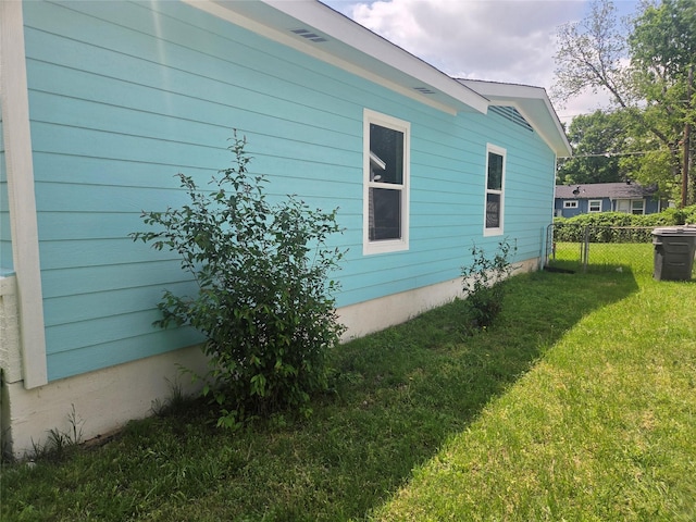 4841 Bromfield St, Dallas, TX 75216 - view of home's exterior with fence and a yard