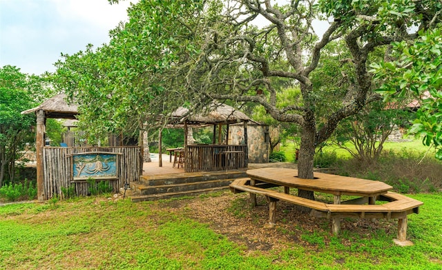 exterior space with a wooden deck and a gazebo