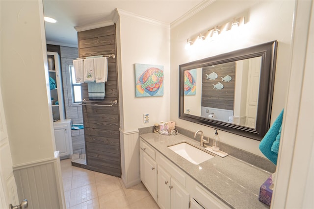 full bathroom featuring wainscoting, crown molding, tile patterned flooring, and vanity