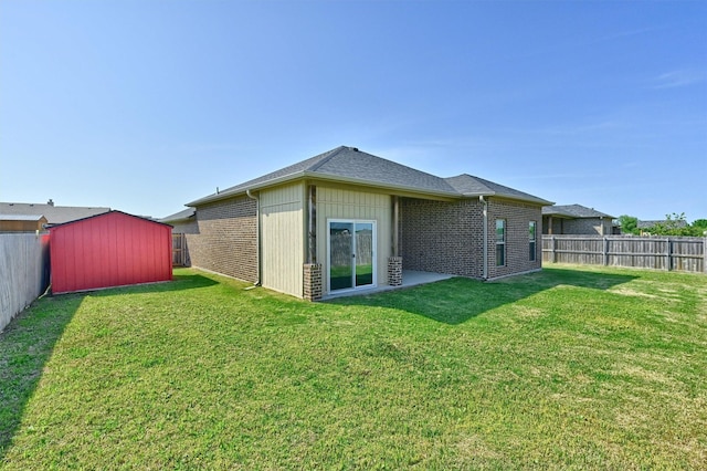 2401 Southridge Ln, Sherman, TX 75092 - back of property featuring a fenced backyard, a shed, and a lawn