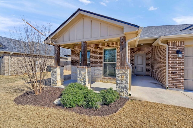 2401 Southridge Ln, Sherman, TX 75092 - view of front of house featuring fence, a shingled roof, board and batten siding, and brick siding