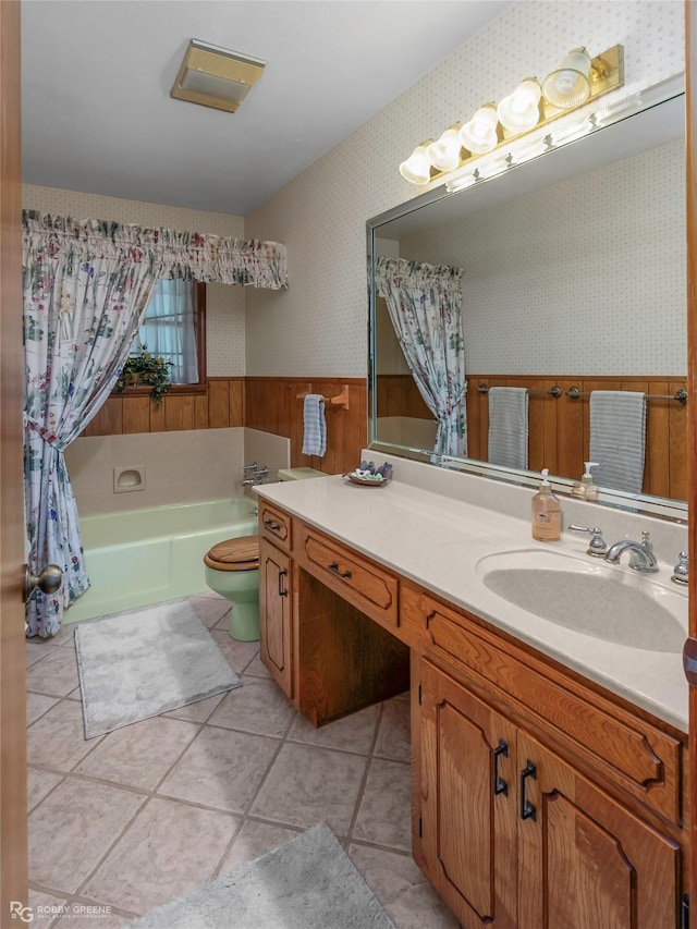 2007 Venus Dr, Bossier City, LA 71112 - full bathroom with wallpapered walls, tile patterned floors, wainscoting, a tub, and vanity