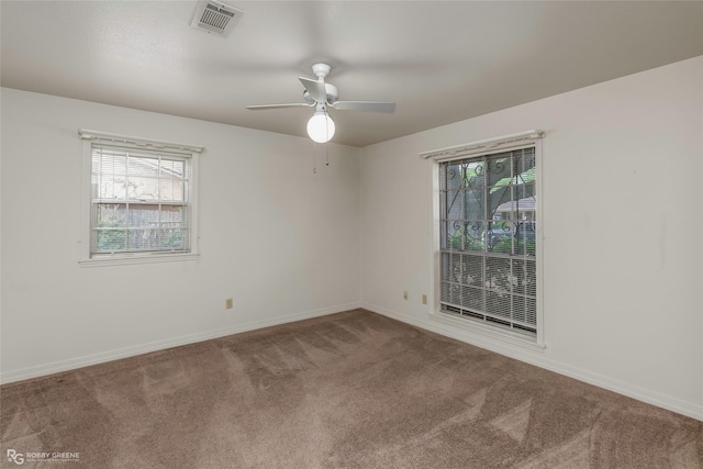 2007 Venus Dr, Bossier City, LA 71112 - spare room featuring a healthy amount of sunlight, carpet flooring, a ceiling fan, and visible vents
