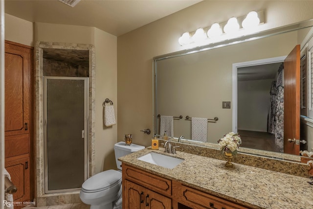 2007 Venus Dr, Bossier City, LA 71112 - full bathroom featuring a shower stall, vanity, and toilet