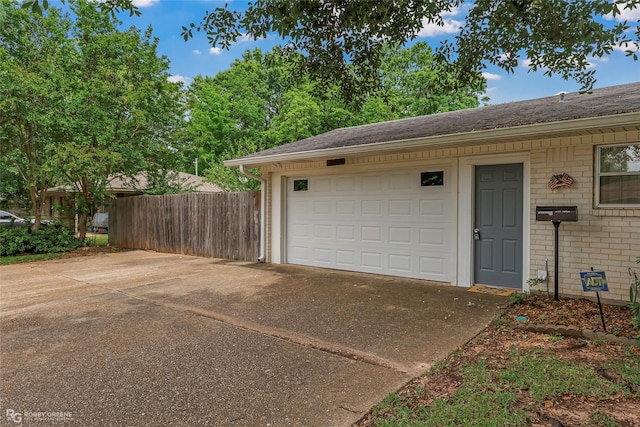 2007 Venus Dr, Bossier City, LA 71112 - garage with concrete driveway and fence
