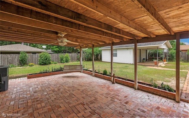 2007 Venus Dr, Bossier City, LA 71112 - view of patio / terrace with a fenced backyard, an outdoor structure, and a ceiling fan