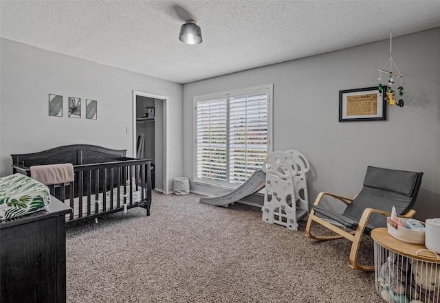 139 Wembley Way, Rockwall, TX 75032 - carpeted bedroom with baseboards and a textured ceiling