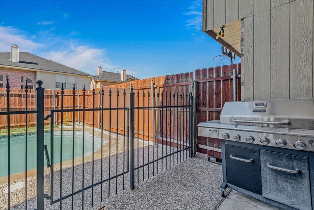 139 Wembley Way, Rockwall, TX 75032 - view of patio / terrace featuring a fenced in pool, a fenced backyard, and a grill