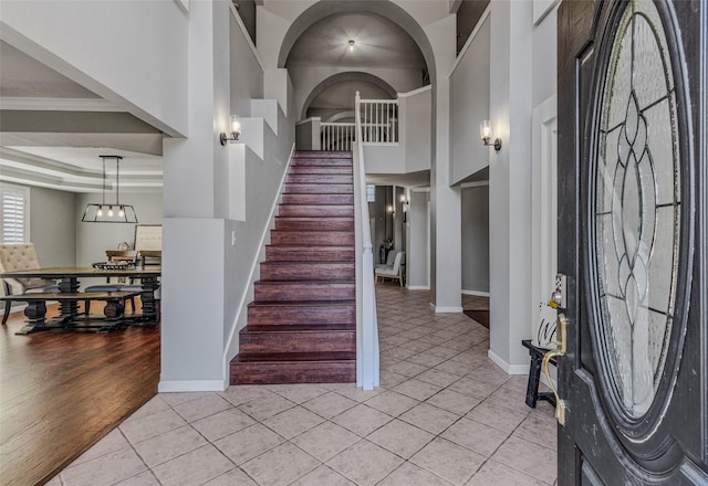 139 Wembley Way, Rockwall, TX 75032 - foyer featuring stairway, baseboards, a high ceiling, and light tile patterned floors