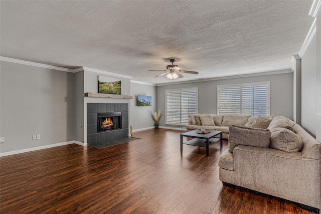 139 Wembley Way, Rockwall, TX 75032 - living area with a ceiling fan, dark wood-style floors, and ornamental molding