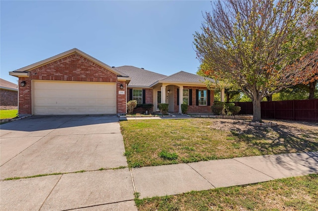717 Baldwin Rd, Wylie, TX 75098 - ranch-style house with brick siding, a garage, and concrete driveway