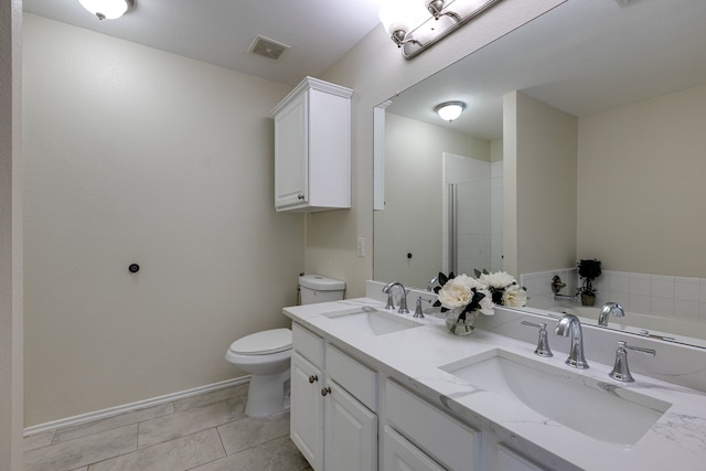 717 Baldwin Rd, Wylie, TX 75098 - full bathroom with toilet, double vanity, a tile shower, baseboards, and tile patterned floors