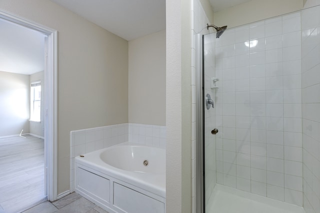 717 Baldwin Rd, Wylie, TX 75098 - full bath featuring a jetted tub, a shower stall, and baseboards
