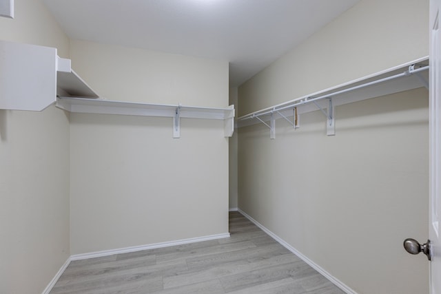 717 Baldwin Rd, Wylie, TX 75098 - spacious closet featuring wood finished floors