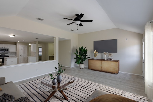717 Baldwin Rd, Wylie, TX 75098 - living area with a ceiling fan, lofted ceiling, light wood finished floors, and baseboards