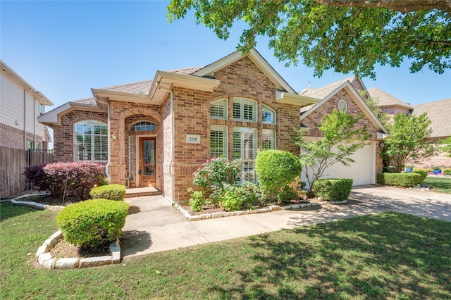 2110 Watercrest Ct, Keller, TX 76248 - view of front of home featuring fence, an attached garage, driveway, brick siding, and a front yard
