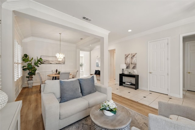 2110 Watercrest Ct, Keller, TX 76248 - living room featuring recessed lighting, an inviting chandelier, visible vents, ornamental molding, and light wood-type flooring