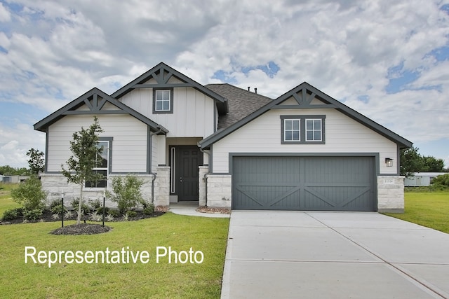 craftsman-style home with stone siding, driveway, a front lawn, and board and batten siding