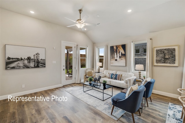 living room featuring recessed lighting, lofted ceiling, wood finished floors, baseboards, and ceiling fan