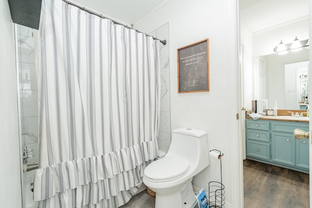 bathroom featuring vanity, curtained shower, ornamental molding, and toilet