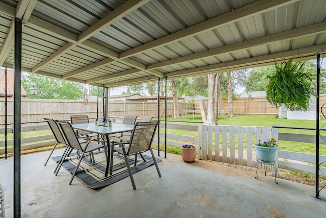 view of patio featuring outdoor dining area and a fenced backyard