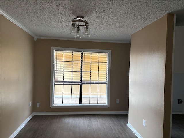 3741 Trinity Ln, Abilene, TX 79602 - spare room featuring dark wood-type flooring, crown molding, baseboards, and a textured ceiling