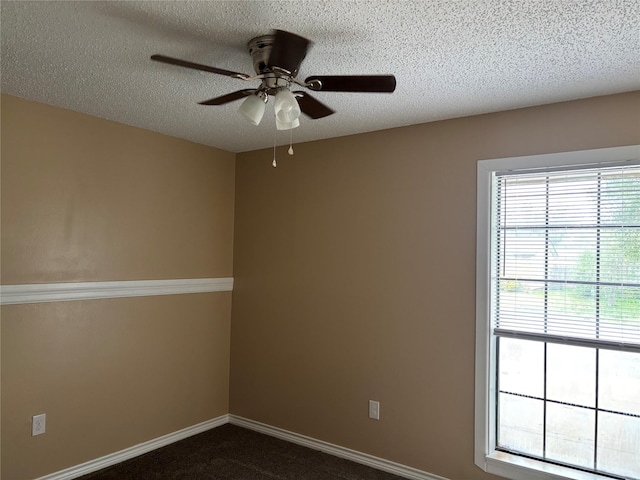 3741 Trinity Ln, Abilene, TX 79602 - unfurnished room featuring ceiling fan, a textured ceiling, baseboards, and dark carpet