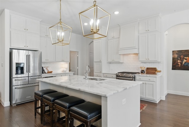 579 Point Vista Dr, Aledo, TX 76008 - kitchen with stainless steel appliances, arched walkways, a chandelier, a sink, and recessed lighting