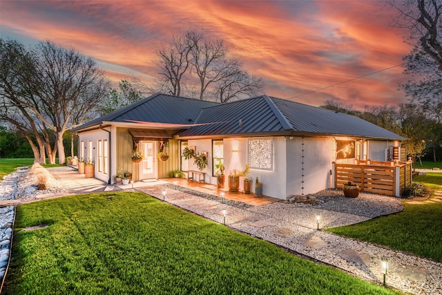 3485 Stonewall Rd, Wylie, TX 75098 - back of property with a lawn, metal roof, and stucco siding