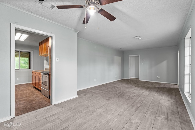1908 Bey St, Bossier City, LA 71112 - empty room with wood finished floors, baseboards, visible vents, a ceiling fan, and a textured ceiling