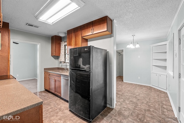 1908 Bey St, Bossier City, LA 71112 - kitchen featuring stainless steel dishwasher, freestanding refrigerator, a sink, visible vents, and a textured ceiling