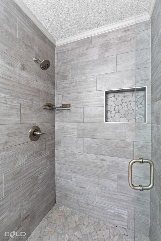 1908 Bey St, Bossier City, LA 71112 - bathroom featuring a stall shower, a textured ceiling, and crown molding