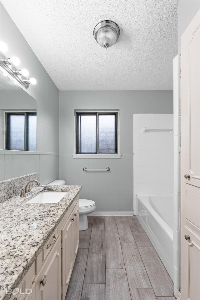 1908 Bey St, Bossier City, LA 71112 - bathroom featuring a wealth of natural light, a textured ceiling, and vanity