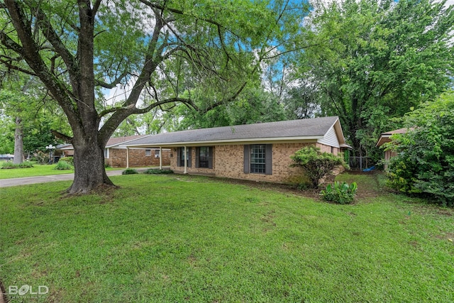 1908 Bey St, Bossier City, LA 71112 - ranch-style house featuring concrete driveway, brick siding, and a front lawn