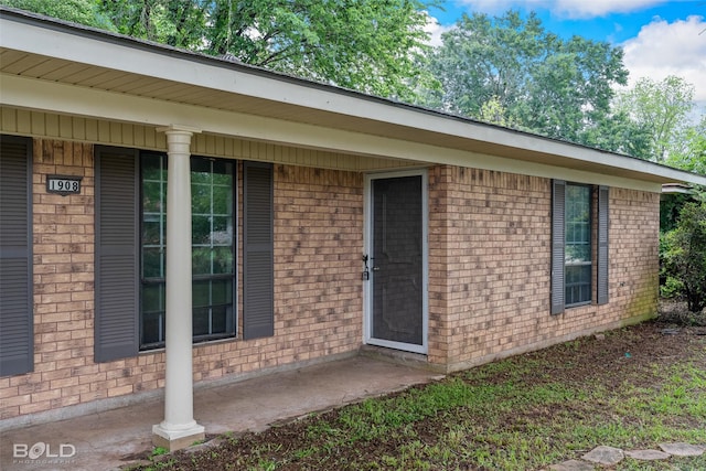 1908 Bey St, Bossier City, LA 71112 - doorway to property featuring brick siding