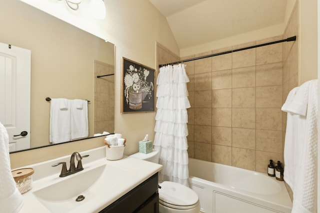 bathroom featuring toilet, shower / tub combo with curtain, lofted ceiling, and vanity