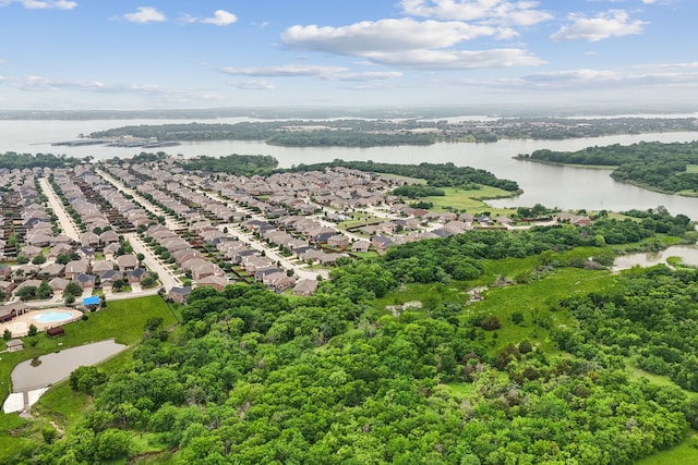 bird's eye view featuring a water view and a residential view
