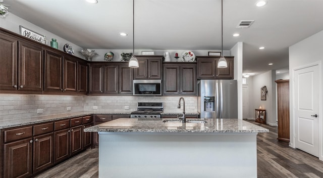 3236 Camden Creek Rd, Krum, TX 76249 - kitchen featuring stainless steel appliances, a sink, dark wood-style floors, dark brown cabinetry, and recessed lighting