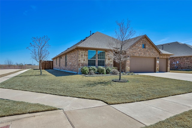 3236 Camden Creek Rd, Krum, TX 76249 - view of front facade featuring a garage, driveway, a shingled roof, stone siding, and brick siding