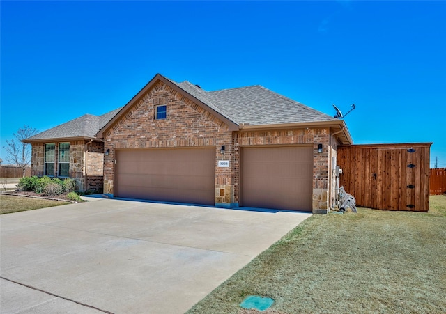 3236 Camden Creek Rd, Krum, TX 76249 - view of front of property with brick siding, a shingled roof, an attached garage, and concrete driveway