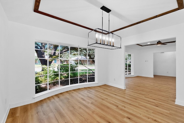 7116 Town Bluff Dr, Dallas, TX 75248 - spare room featuring light wood-style flooring, baseboards, and a chandelier