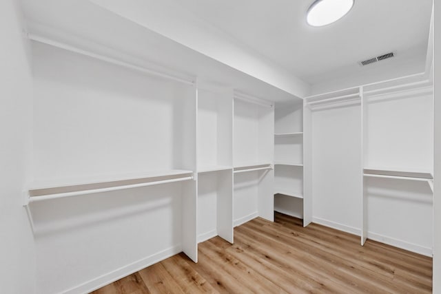 7116 Town Bluff Dr, Dallas, TX 75248 - spacious closet featuring wood finished floors