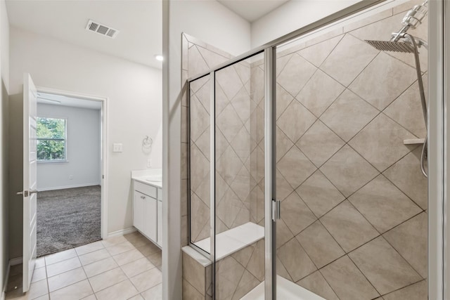 full bathroom featuring visible vents, tile patterned flooring, vanity, and a stall shower