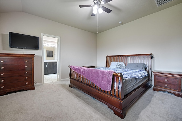 carpeted bedroom featuring ensuite bathroom, ceiling fan, baseboards, lofted ceiling, and visible vents