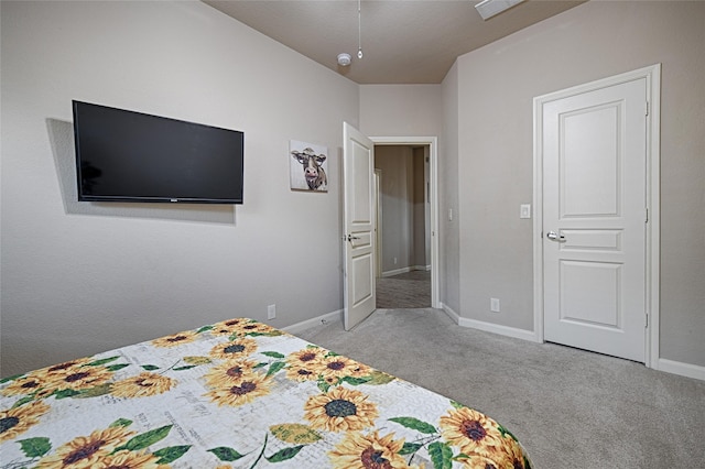 carpeted bedroom featuring baseboards