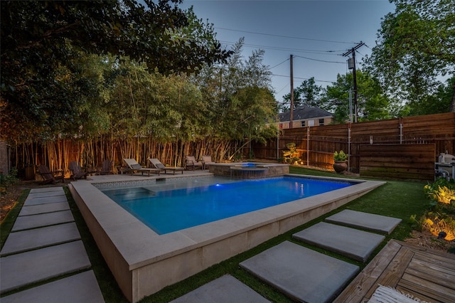 view of pool featuring a fenced backyard, a fenced in pool, and an in ground hot tub